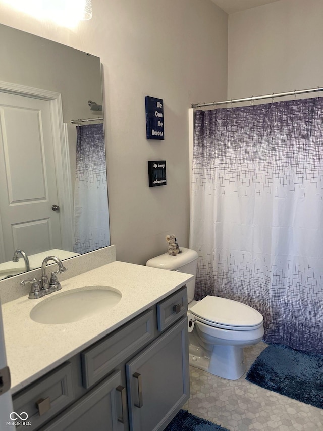 full bathroom with vanity and toilet