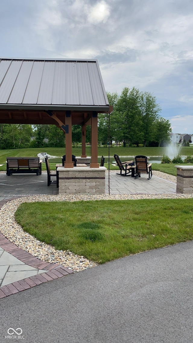 view of community featuring a yard and a gazebo