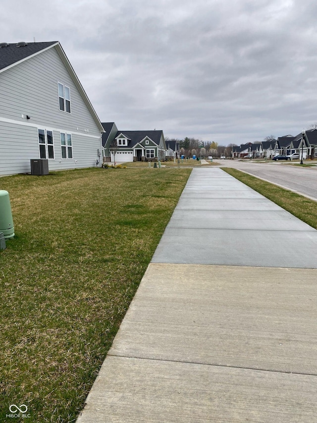 exterior space featuring a residential view and cooling unit