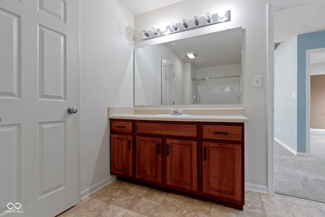 bathroom with vanity and walk in shower