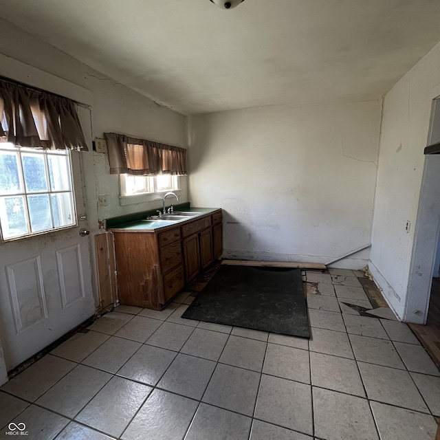 kitchen with light tile patterned flooring and sink