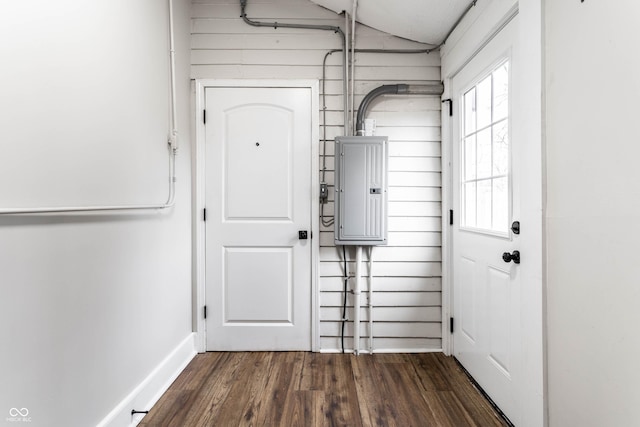 interior space featuring electric panel and dark hardwood / wood-style floors