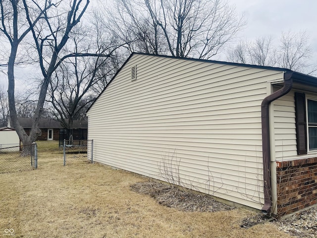 view of home's exterior with a yard