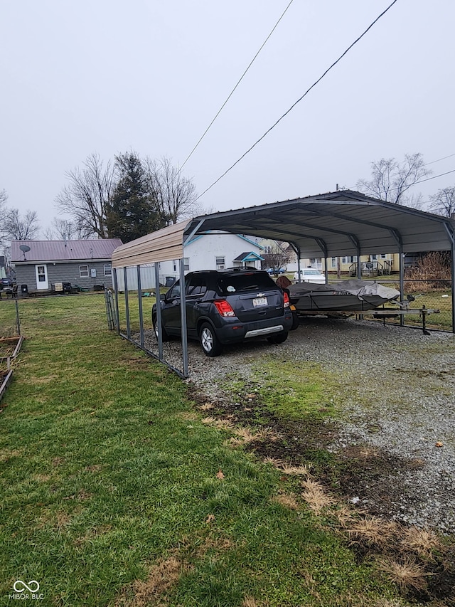 view of car parking featuring a carport and a lawn