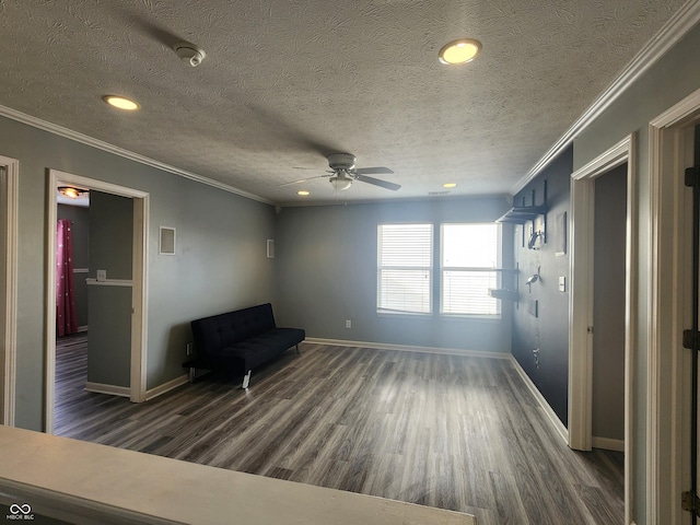 unfurnished room with crown molding, dark wood-type flooring, and ceiling fan