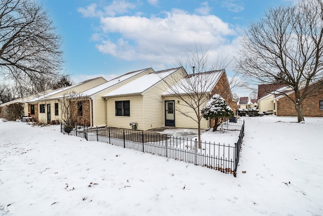 single story home with fence