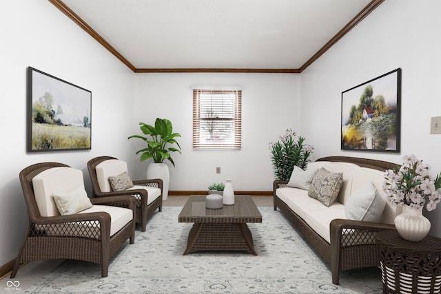 sitting room featuring baseboards and ornamental molding