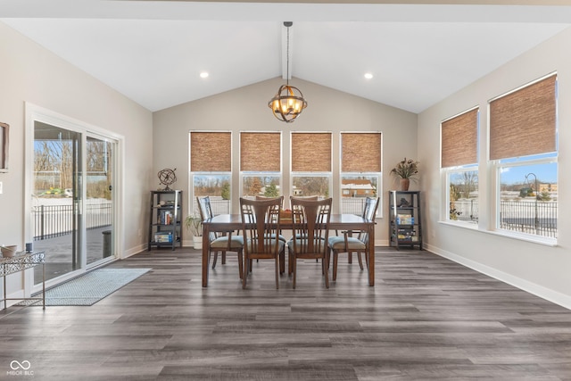 unfurnished dining area featuring dark hardwood / wood-style floors, a chandelier, and vaulted ceiling with beams