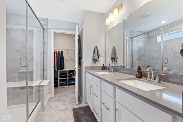 bathroom with vanity and an enclosed shower