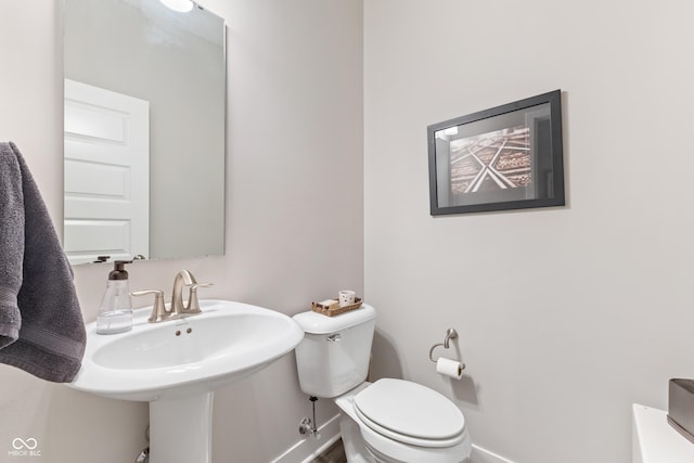 bathroom featuring sink and toilet