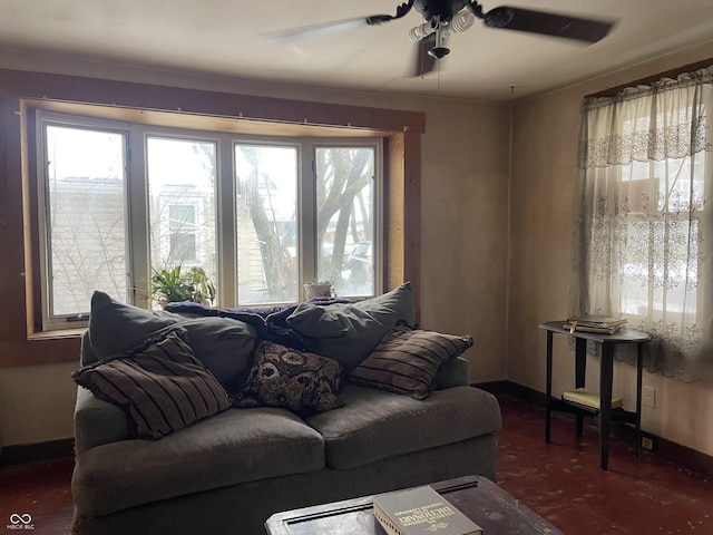 living room with ceiling fan and a wealth of natural light