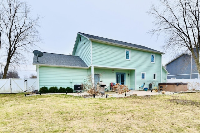 11710 E 75th St, Indianapolis, IN 46236 - back of property with central AC, a hot tub, a lawn, and a patio area