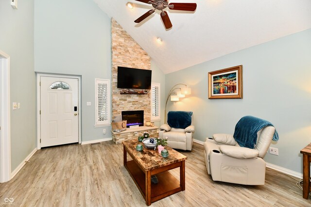 11710 E 75th St, Indianapolis, IN 46236 - living room with ceiling fan, high vaulted ceiling, light wood-type flooring, and a fireplace