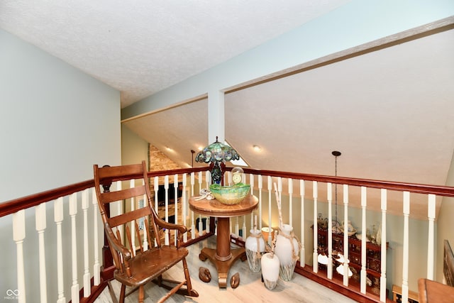 11710 E 75th St, Indianapolis, IN 46236 - sitting room with vaulted ceiling, hardwood / wood-style floors, and a textured ceiling