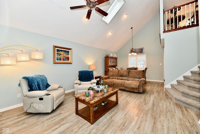 11710 E 75th St, Indianapolis, IN 46236 - living room featuring ceiling fan, high vaulted ceiling, light hardwood / wood-style floors, and a skylight