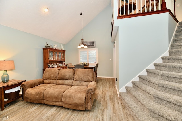 11710 E 75th St, Indianapolis, IN 46236 - living room with an inviting chandelier, wood-type flooring, and high vaulted ceiling