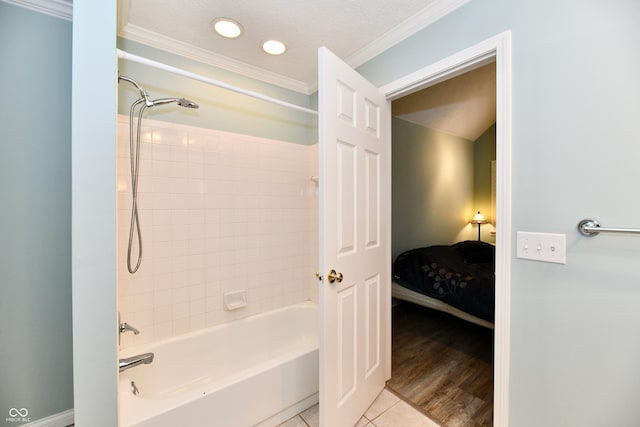 11710 E 75th St, Indianapolis, IN 46236 - bathroom featuring tiled shower / bath, ornamental molding, tile patterned flooring, and a textured ceiling