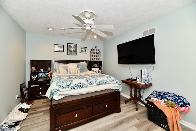 11710 E 75th St, Indianapolis, IN 46236 - bedroom with ceiling fan, light hardwood / wood-style flooring, and a textured ceiling