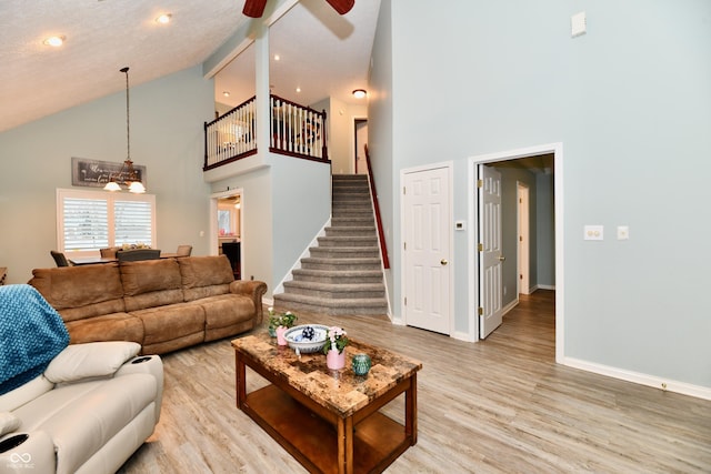 11710 E 75th St, Indianapolis, IN 46236 - living room featuring ceiling fan, high vaulted ceiling, and light hardwood / wood-style floors