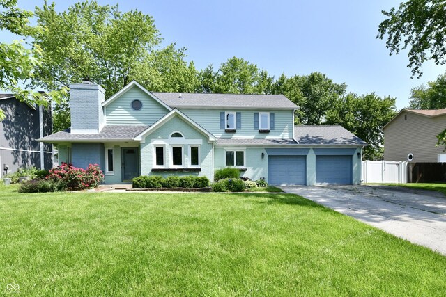11710 E 75th St, Indianapolis, IN 46236 - view of front of home with a garage, a chimney, asphalt driveway, brick siding, and a shingled roof