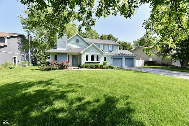11710 E 75th St, Indianapolis, IN 46236 - view of front of home featuring driveway, an attached garage, a chimney, a front yard, and a shingled roof