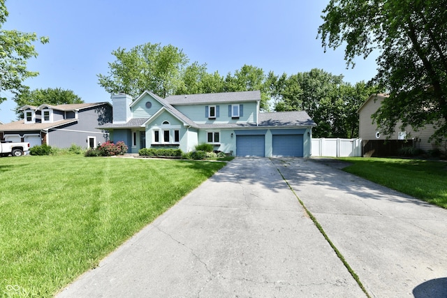 11710 E 75th St, Indianapolis, IN 46236 - view of front of home featuring an attached garage, concrete driveway, and a chimney