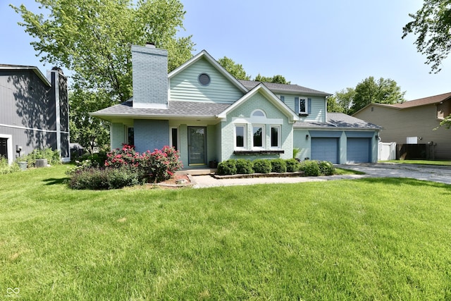 11710 E 75th St, Indianapolis, IN 46236 - view of front of home featuring an attached garage, brick siding, driveway, and a chimney