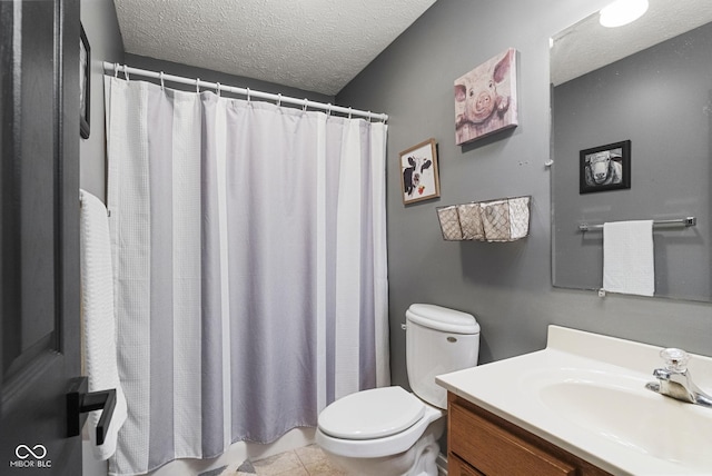 bathroom featuring vanity, a textured ceiling, curtained shower, tile patterned floors, and toilet