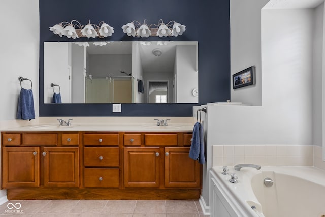 bathroom with vanity, tile patterned floors, and separate shower and tub