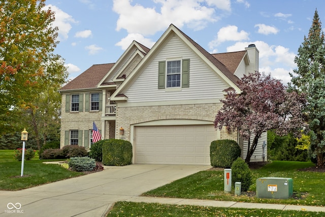 view of front of home featuring a garage and a front lawn