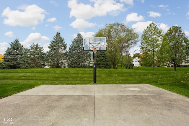 view of patio featuring basketball hoop