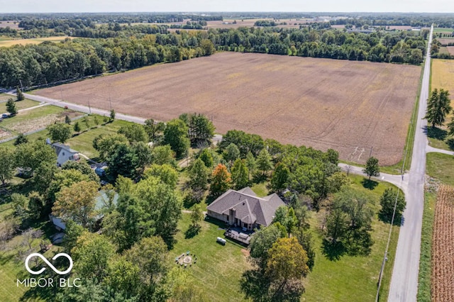 birds eye view of property with a rural view