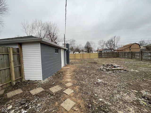 view of yard with a fire pit