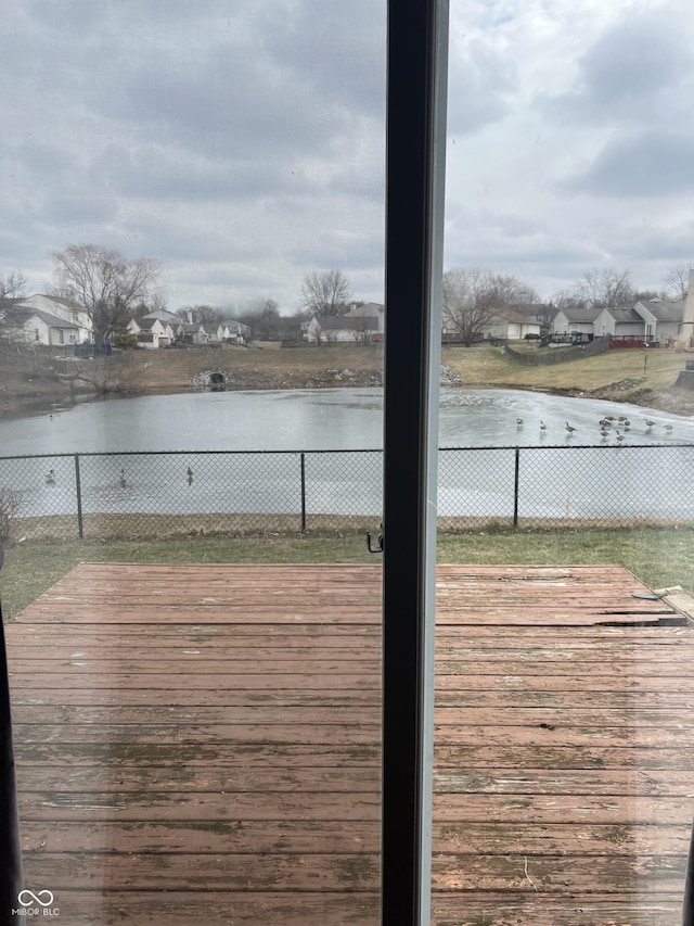 wooden deck with a water view