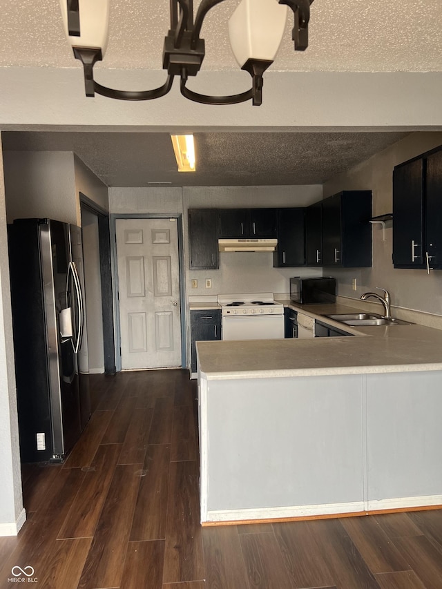 kitchen featuring sink, kitchen peninsula, stainless steel fridge with ice dispenser, and white range with electric stovetop