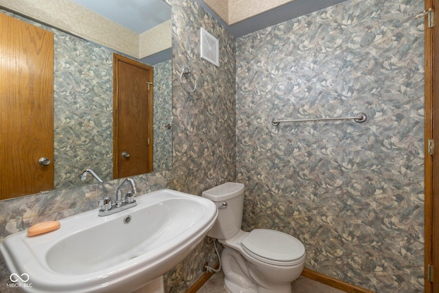 bathroom featuring sink and toilet