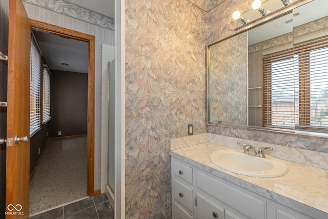 bathroom with vanity and tile patterned flooring