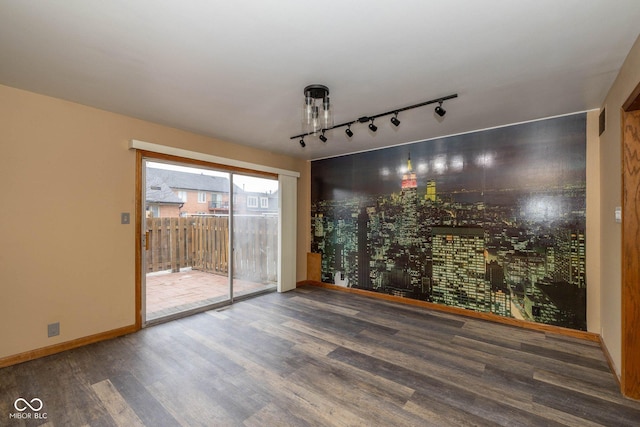 unfurnished room featuring hardwood / wood-style flooring