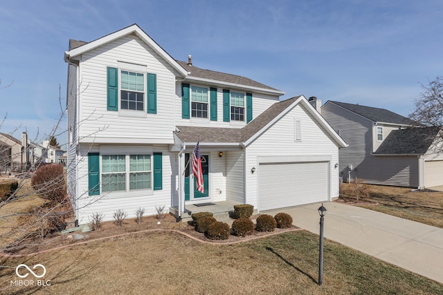 view of front of property featuring a garage and a front lawn