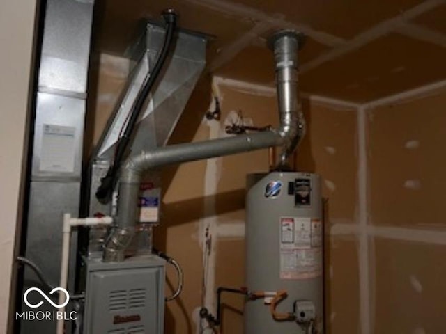 utility room featuring gas water heater