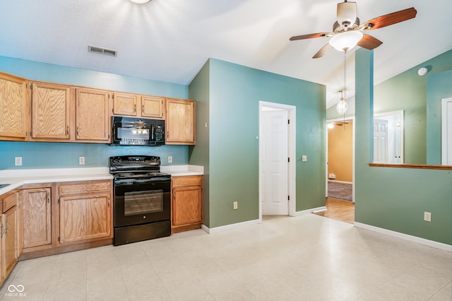 kitchen with ceiling fan, vaulted ceiling, and black appliances