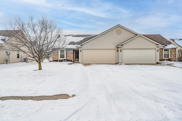 ranch-style house featuring a garage