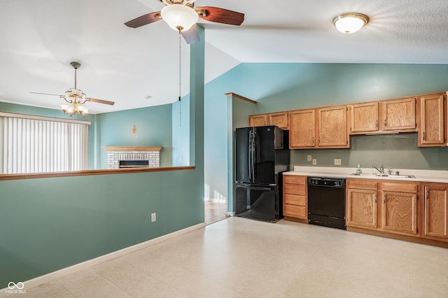 kitchen with lofted ceiling, a brick fireplace, black appliances, sink, and ceiling fan