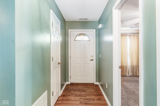 doorway with wood-type flooring