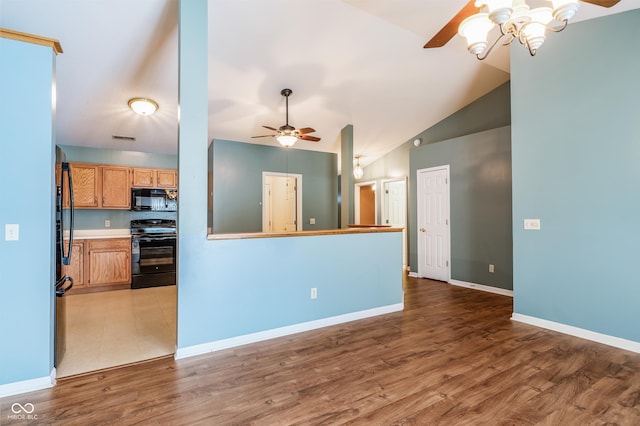 kitchen with hardwood / wood-style floors, electric stove, vaulted ceiling, ceiling fan, and kitchen peninsula