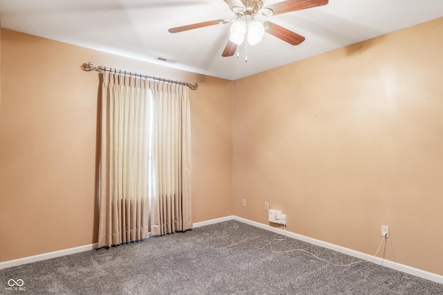 carpeted empty room featuring ceiling fan