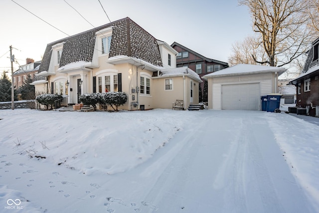 view of front of home featuring mansard roof