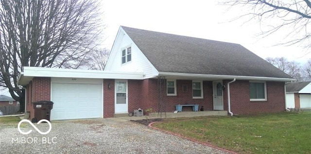 view of front facade featuring a garage and a front lawn