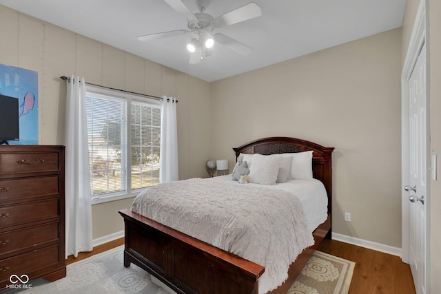 bedroom featuring hardwood / wood-style floors and ceiling fan