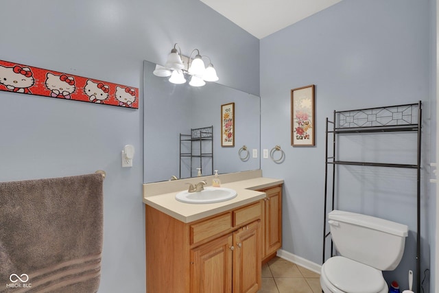 bathroom featuring tile patterned floors, toilet, and vanity